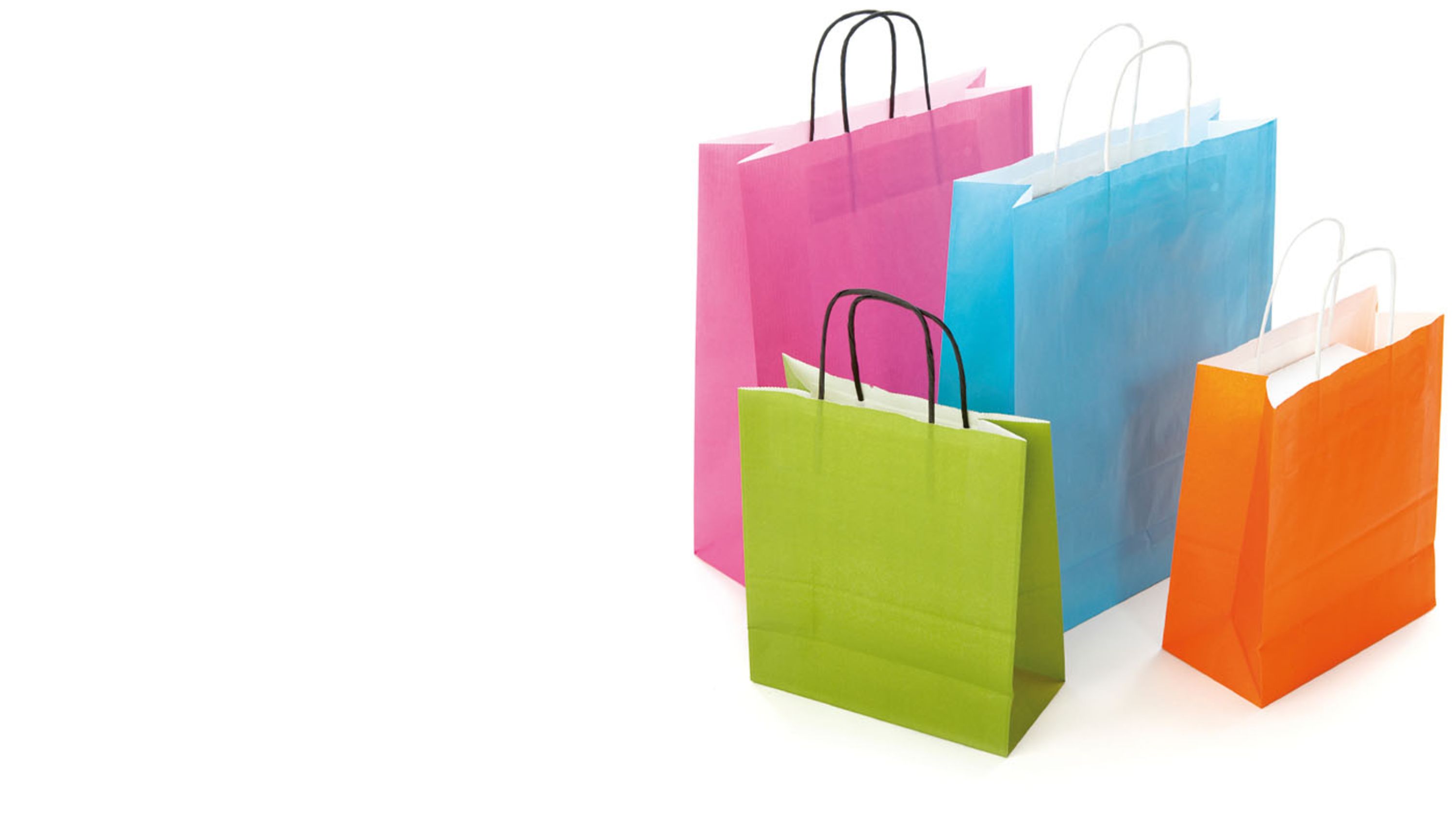 Mehrere bunte Papiereinkaufstaschen.